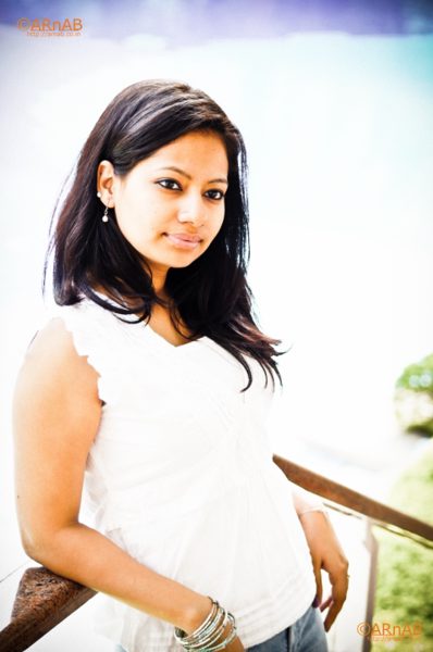 In white, by the railing